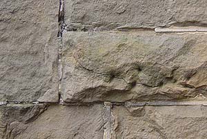 cracking sandstone facade